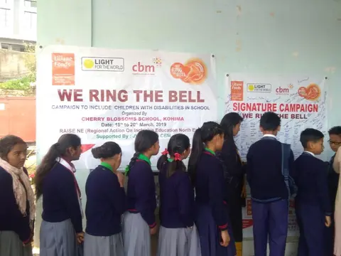 Various school students signing on the Signature Campaign for 'Ring the Bell' activity for RAISE-NE.