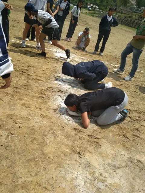 Students during the obstacle race segment of 'Maida & Coin' game.